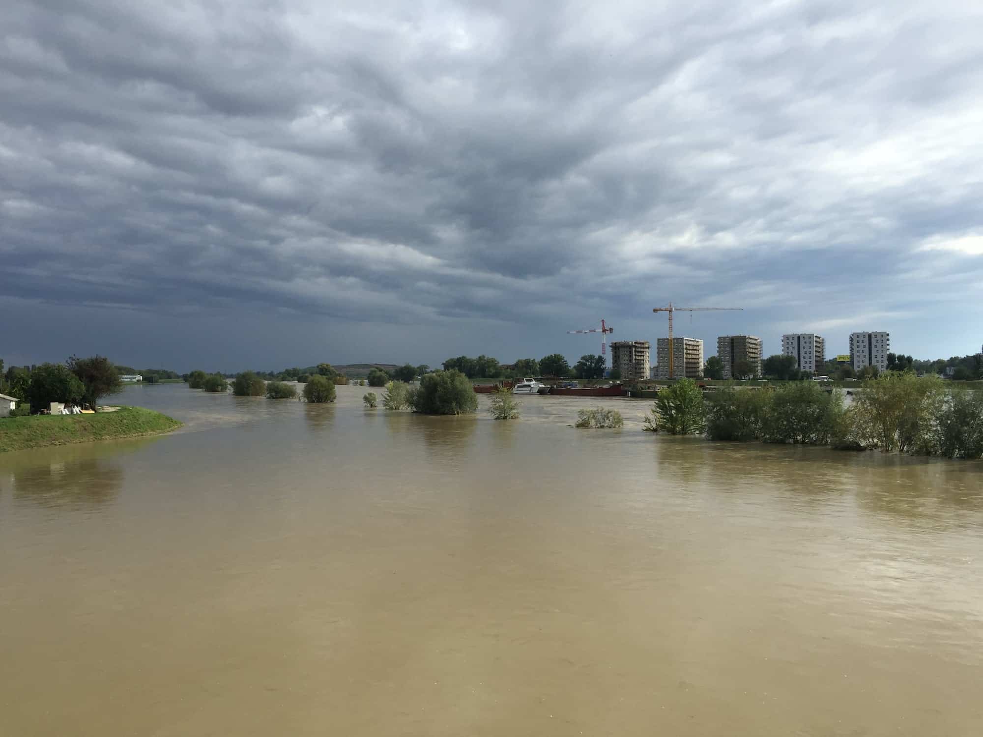 Flooded area in suburbs under stormy clouds